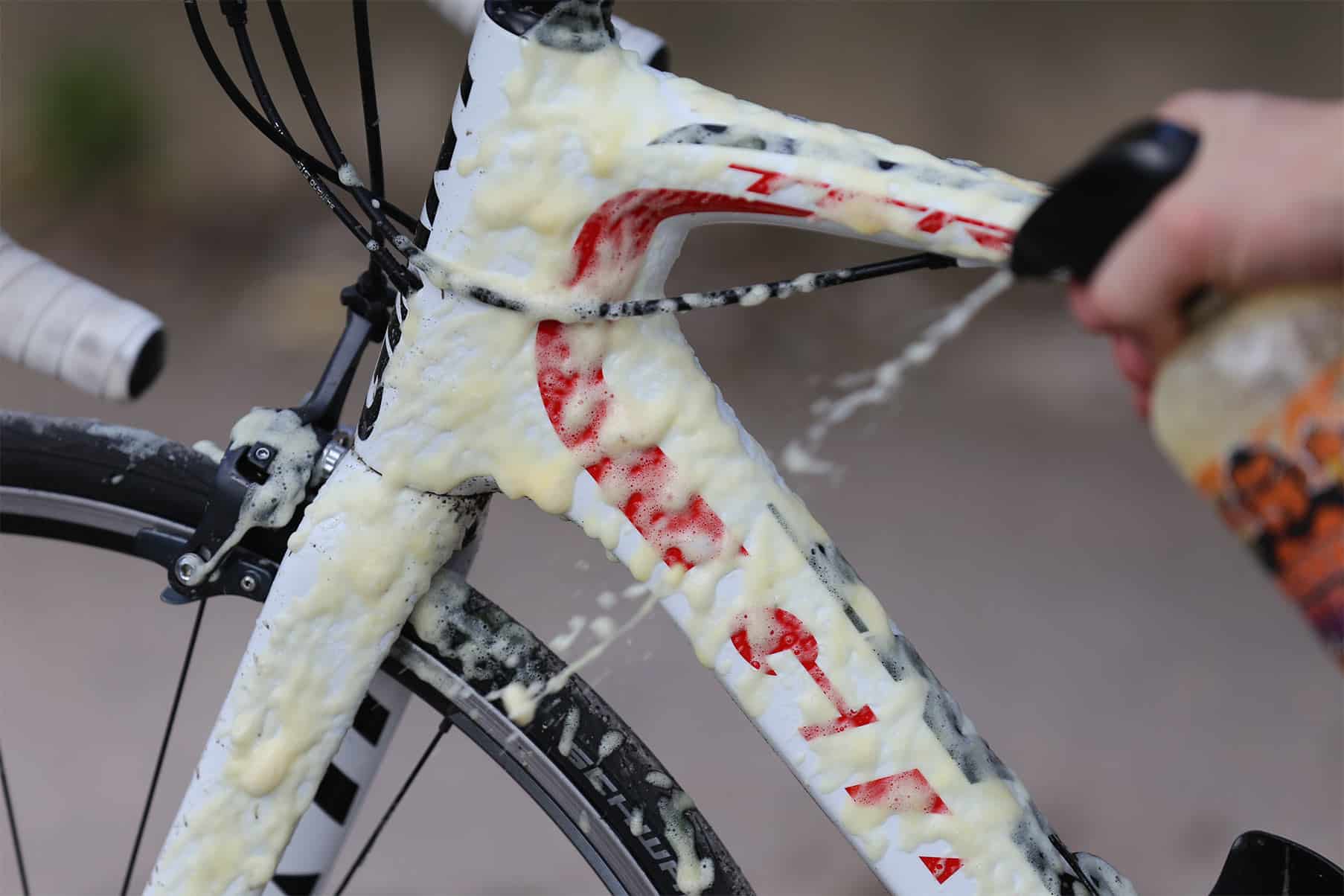 Person cleaning their bike with Tru-Tension's Gel Bike Cleaner